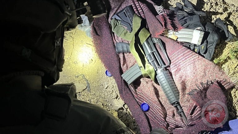 A picture published by the occupation army with the weapons of the detainees