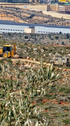 The occupation army demolishes walls and confiscates an excavator in the village of Farkha