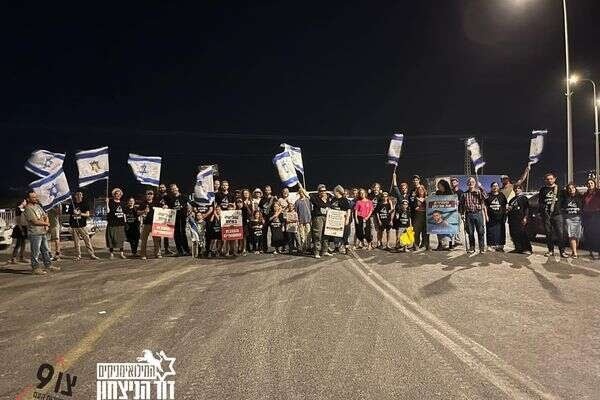 Israeli activists block a humanitarian aid convoy heading to Gaza via the Karameh crossing.