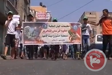 اطفال غزة ينظمون جنازة رمزية للشهيد دوابشة