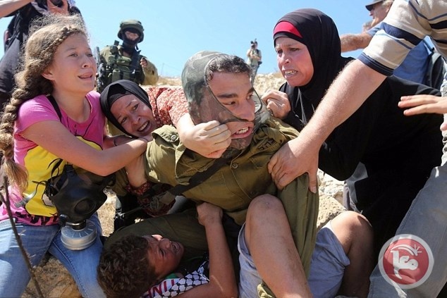 &lt;div&gt;صورة وتعليق: &lt;/div&gt;هكذا حررت النسوة طفلا من براثن الاحتلال في النبي صالح