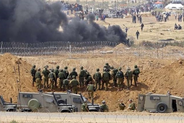 الاحتلال يسحب قواته التي حشدها على حدود غزة
