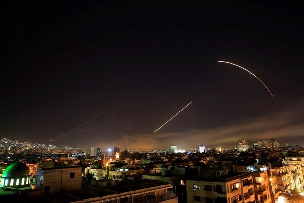 Syrian defenses confront an Israeli attack in the vicinity of the capital, Damascus