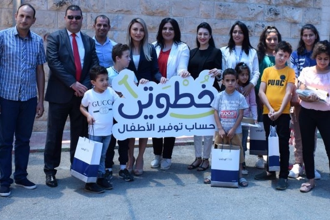 البنك الوطني يسلم الدفعة الأولى من أجهزة نت كتابي لقرى الأطفال