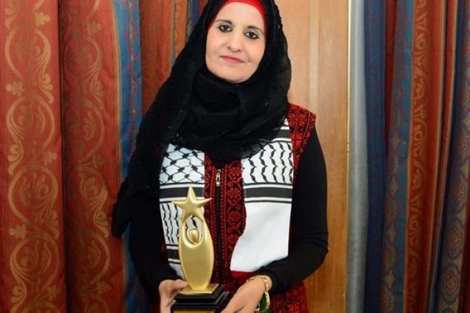 الحرازين أول فلسطينية تحصل على الوسام الذهبي للمرأة العربية